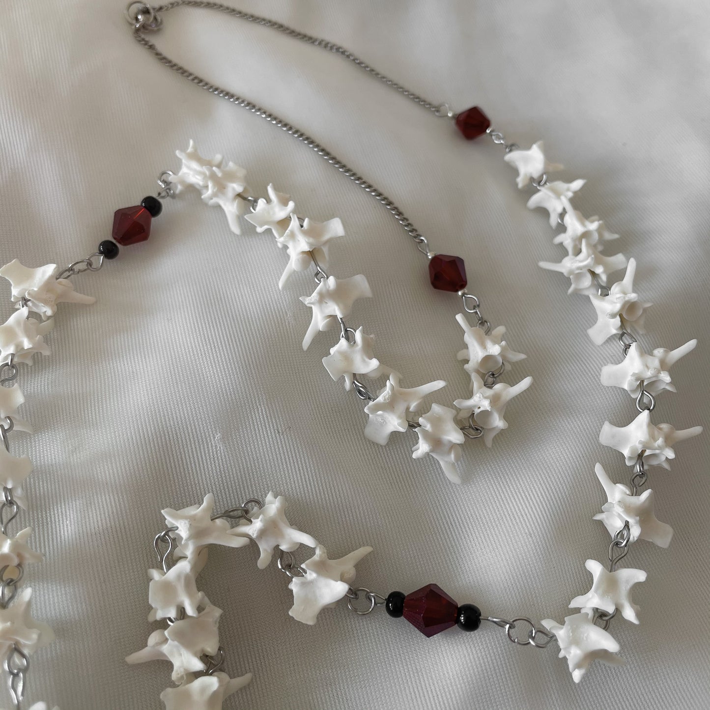 Bleeding heart bone rosary w/ Catholic Relic