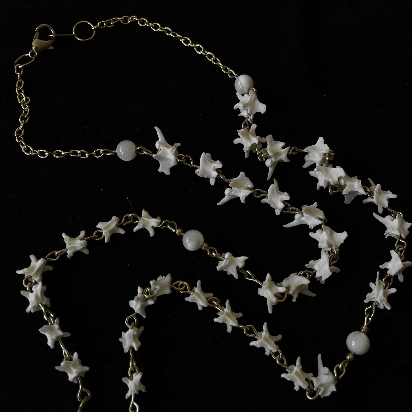 Bone rosary w/ glass locket