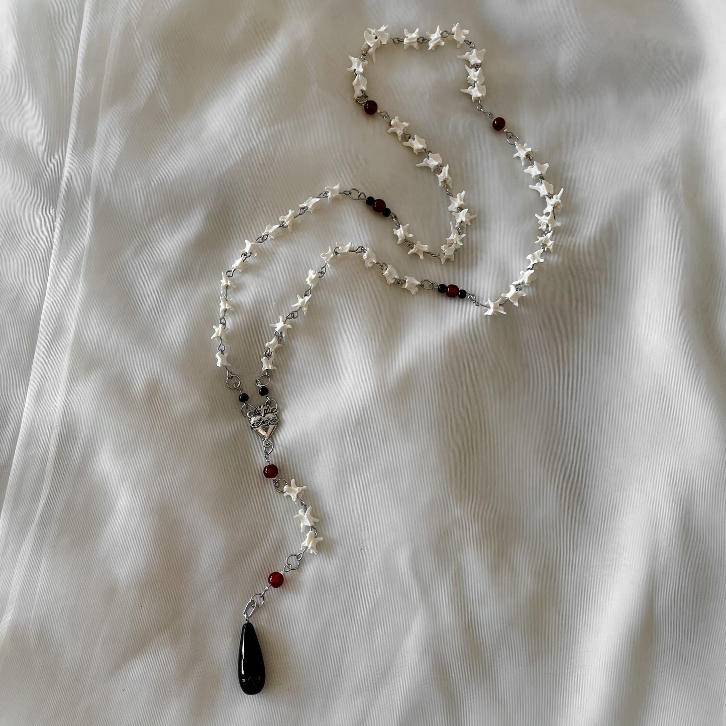 Sacred heart bone rosary w/ black onyx pendant