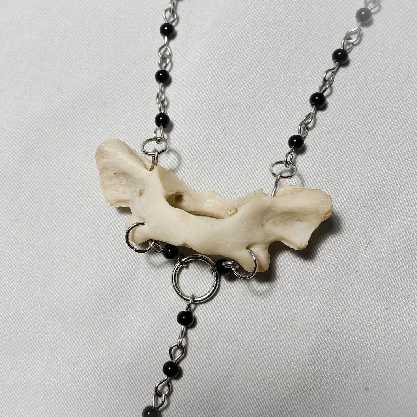 Raccoon atlas necklace w/ cross