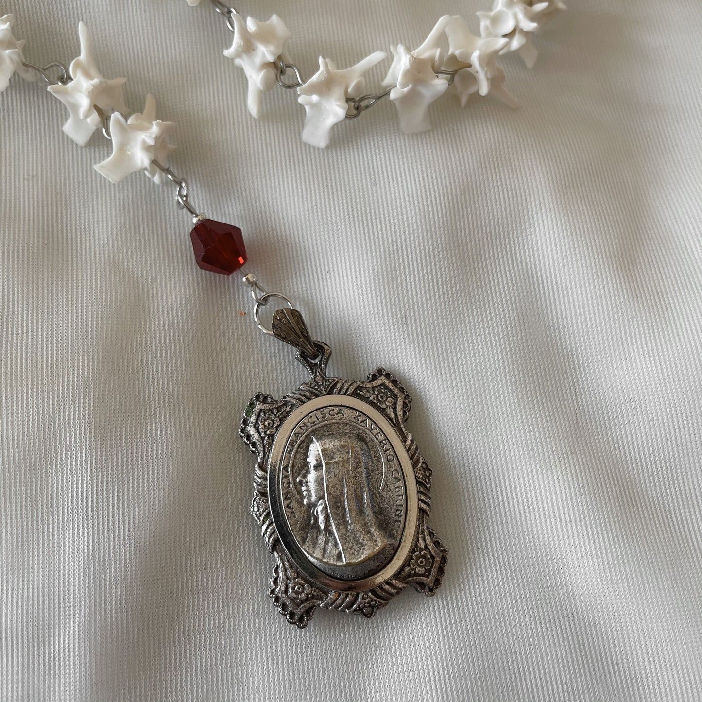 Bleeding heart bone rosary w/ Catholic Relic