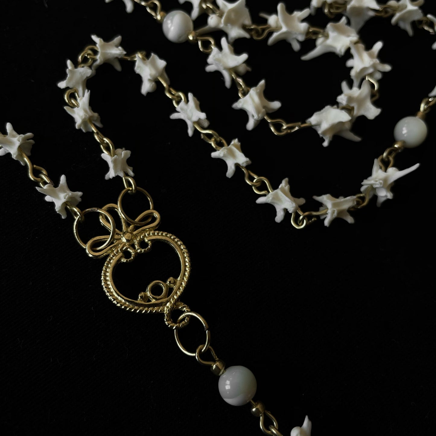 Bone rosary w/ glass locket