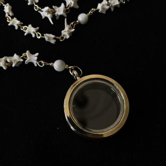 Bone rosary w/ glass locket