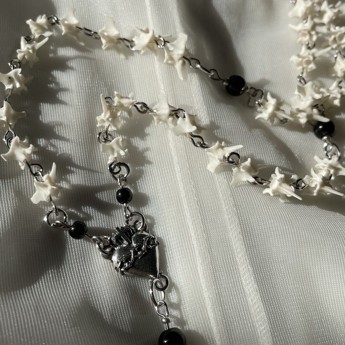 Sacred heart bone rosary w/ black onyx